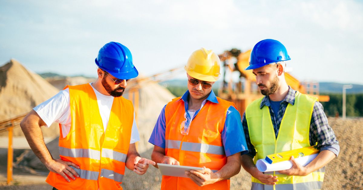 Tradesmen using Job Management Software on site